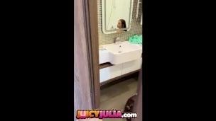 Juicy Julia peeing in bathroom and showing her big tits